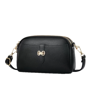 Minimalist black multi-layer leather crossbody bag with golden hardware and adjustable strap