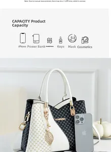 Detail of bicolored tote bag with logo print showing capacity for phone and accessories