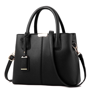 Classic black lychee pattern leather handbag with golden hardware and shoulder strap