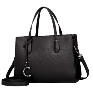 Elegant black faux leather tote bag with silver C-pendant and removable shoulder strap
