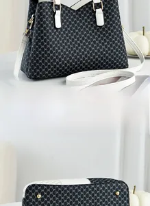 Macro shot of handbag base with protective metal feet and monogram leather texture