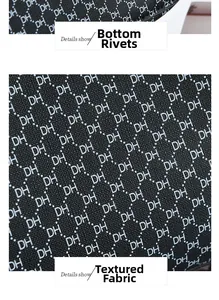 Close-up of black handbag fabric with white DH monogram and protective base studs