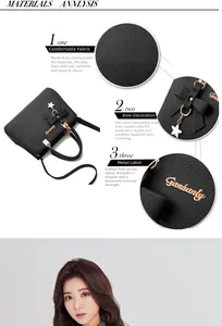 Detail of black lychee texture PU leather handbag with ribbon and golden metal logo