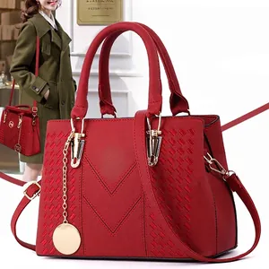 Fashion red tote bag for women with woven texture and elegant metal pendant detail