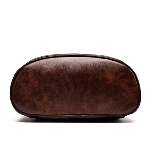 Bottom view of vintage brown soft leather backpack with durable reinforced edges