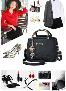 Detail of black embroidered leather handbag with golden ring handle and lifestyle accessories