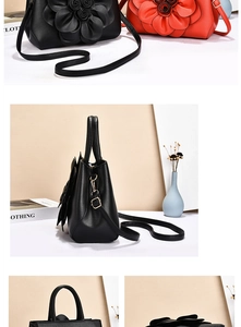 Close-up of 3D layered floral design and leather texture on luxury women's handbag