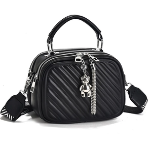 Large black quilted tote bag with silver hardware, bear pendant and wide jacquard strap