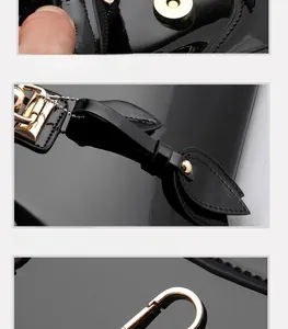 Detail of black glossy patent leather handbag featuring gold metal hooks and magnetic closure