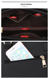 Internal compartments of black pebbled leather tote bag with gold zipper and phone pocket