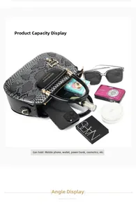 Top view of spacious black tote interior showing capacity for phone, camera and cosmetics
