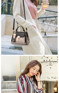 Detail of crossbody bag featuring plaid pattern, metal buckle and cute pink bear charm