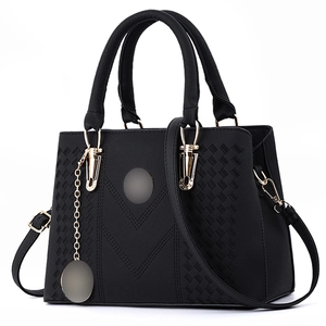 Black PU leather handbag with woven embroidery texture and gold chain pendant detail