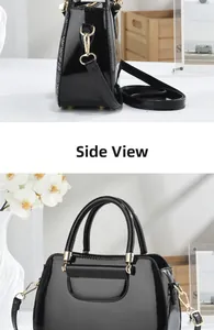 Detail of glossy black patent leather handbag with snake pattern side and gold hardware