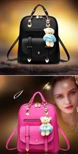 Detail view of lychee grain PU leather backpacks with bear charms and metal locks