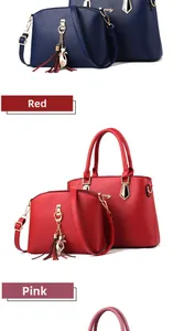 Detail view of stylish tote and crossbody bag set in multiple colors with gold cat charm
