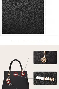 Close-up of black lychee grain leather handbag with gold hardware and tassel detail