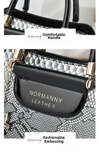 Close-up of snakeskin pattern leather handbag with gold logo and luxury chain detail