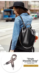 Detail of detachable striped woven shoulder strap with metal hooks for black leather backpack