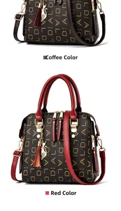 Detail of elegant two-tone tote bag with fox pendant and metal tassel decoration