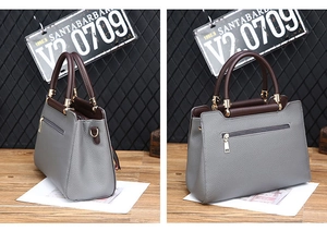 Détails de l'arrière et du profil du sac à main gris en cuir grainé avec anses brunes