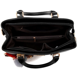 Black pebbled leather tote bag with large capacity, floral scarf, and plush pendant