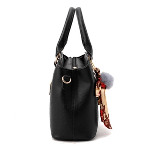Classic black litchi pattern leather tote bag with elegant silk scarf and fur ball charm