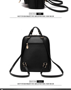 Detail view of the black leather backpack featuring a secure back anti-theft zipper pocket