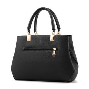 Classic black leather handbag for women featuring a practical back zipper with heart charm