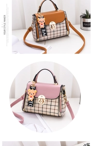 Detail of plaid crossbody bags with round metal locks and cute bear charms