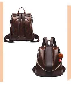 Detail of vintage brown leather backpack featuring anti-theft back zipper and furry pendant