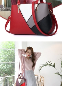 Close-up of geometric color block handbag with gold hardware and removable strap details