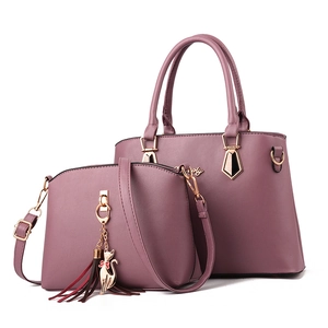 Elegant purple leather tote and crossbody bag set with decorative kitten charm