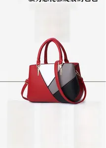 Detail of high-quality gold star charm and zipper on the leather patchwork tote bag