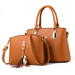 Caramel brown leather tote and crossbody bag set with gold cat charm and tassel