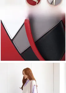 Detail showing the color-block stitching and lychee grain leather texture on a tote bag