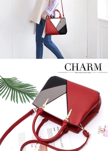 Detail of color-block geometric tote bag with gold metal buckle and detachable shoulder strap