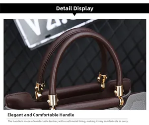 Détail de la poignée en cuir marron et attaches dorées sur un sac cabas gris perle