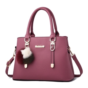 Elegant rose red tote bag with lychee texture, golden hardware and tricolor fur pompom charm