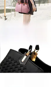 Detail of color-block tote bag showing reinforced golden hardware and woven texture strap