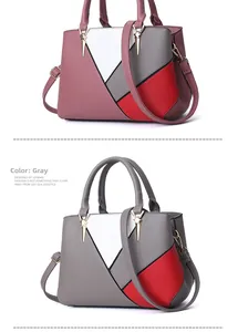 Detail of the gray geometric patchwork handbag with gold star hardware and crossbody strap