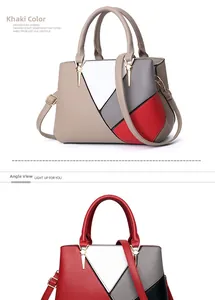 Detail showing the geometric color-blocking design and gold hardware on a leather handbag