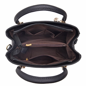Classic black leather handbag for women featuring spacious multi-compartment interior
