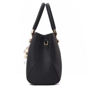 Classic black pebbled leather tote bag with gold hardware and pearl charm decoration