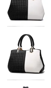 Detail view of woven leather texture and black and white contrast on the handbag