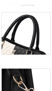 Close-up of contrast color tote bag showing round embossed texture and gold metal hardware