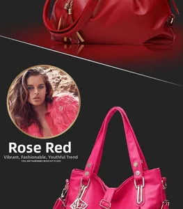 Detail of rose red and dark red leather tote bags with lychee texture and gold hardware