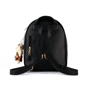 Chic black faux leather backpack for women with adjustable straps and cute plush bear charm