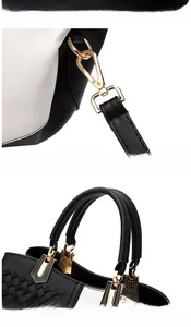 Detail of golden hardware and woven leather texture on a stylish black and white handbag