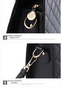 Details vergoldeter Beschläge und Reißverschluss an der gesteppten Lederhandtasche